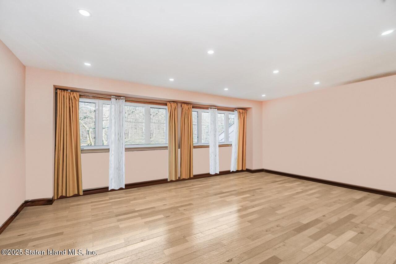 111 Hampton Green Staten Island, NY 10312 - Photo 6 of 19 a view of an empty room with a window