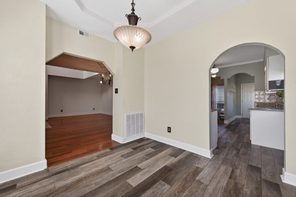 6610 Sprigg Street Fulshear, TX 77441 - Photo 14 of 49 a view of a hallway view with wooden floor and staircase