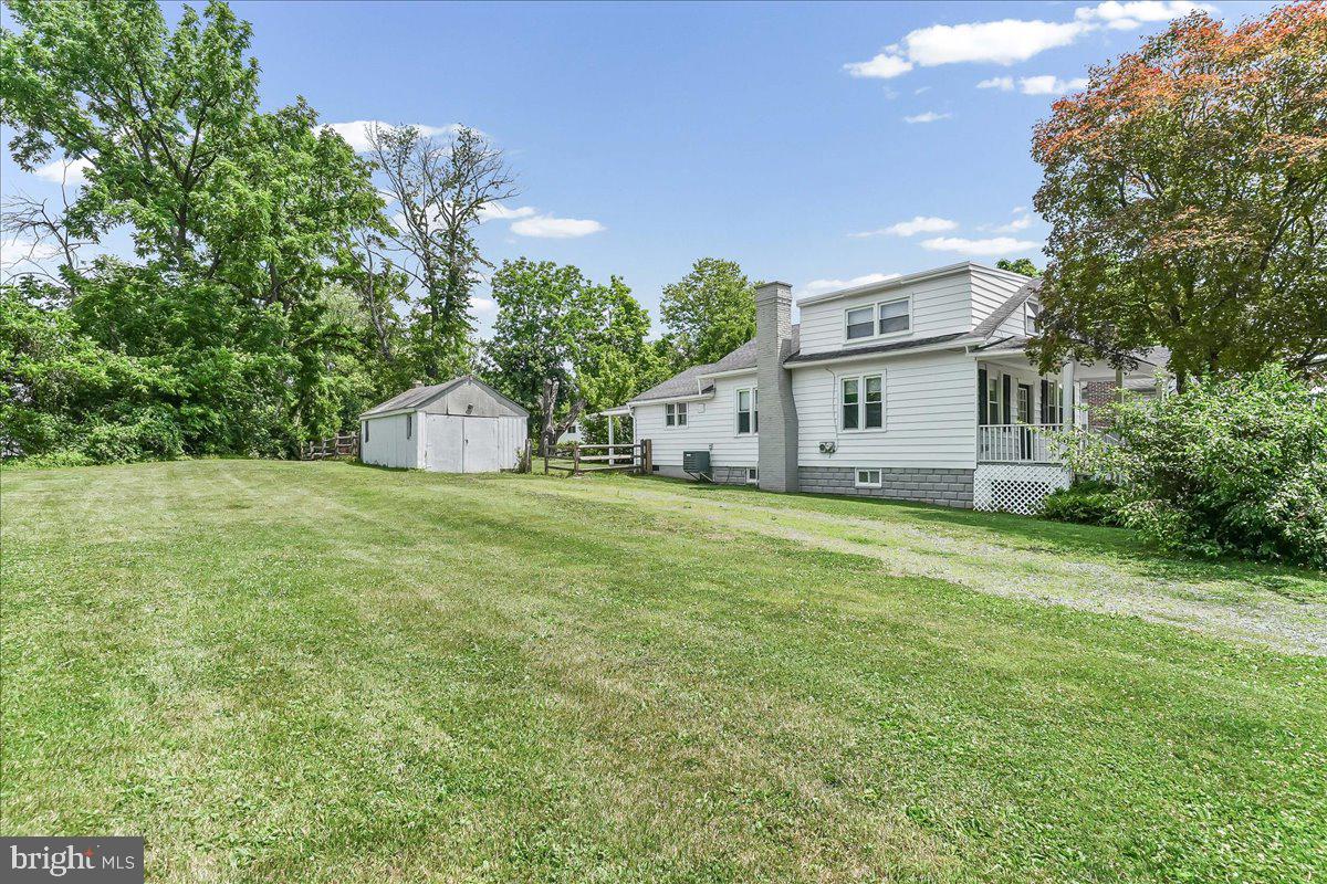 1019 Riverside Drive Pottstown, PA 19465 - Photo 2 of 36 Spacious yard with charming home backdrop.