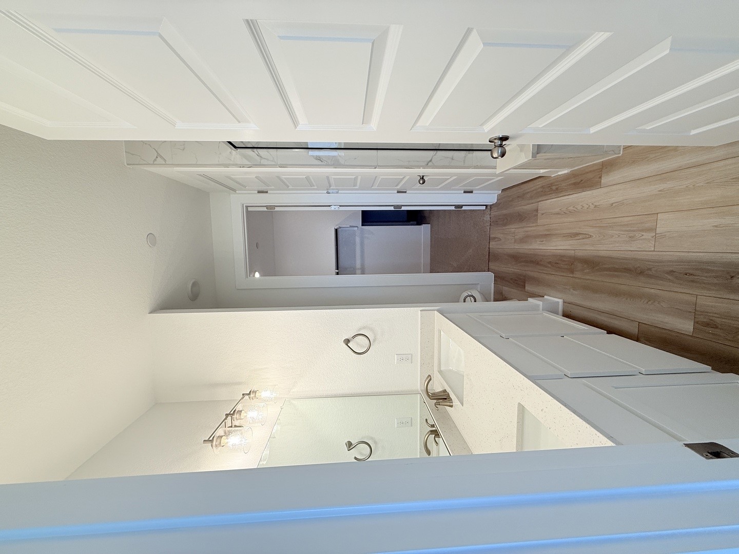2546 Jack Nora Way Round Rock, TX 78665 - Photo 2 of 8 Full bathroom with light wood-style flooring, double vanity, a spacious closet, and a stall shower