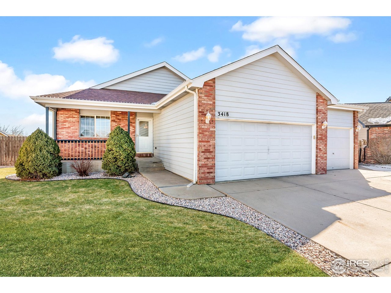 3418 Windmill Court Evans, CO 80620 - Photo 2 of 31 a view of backyard of house and garage