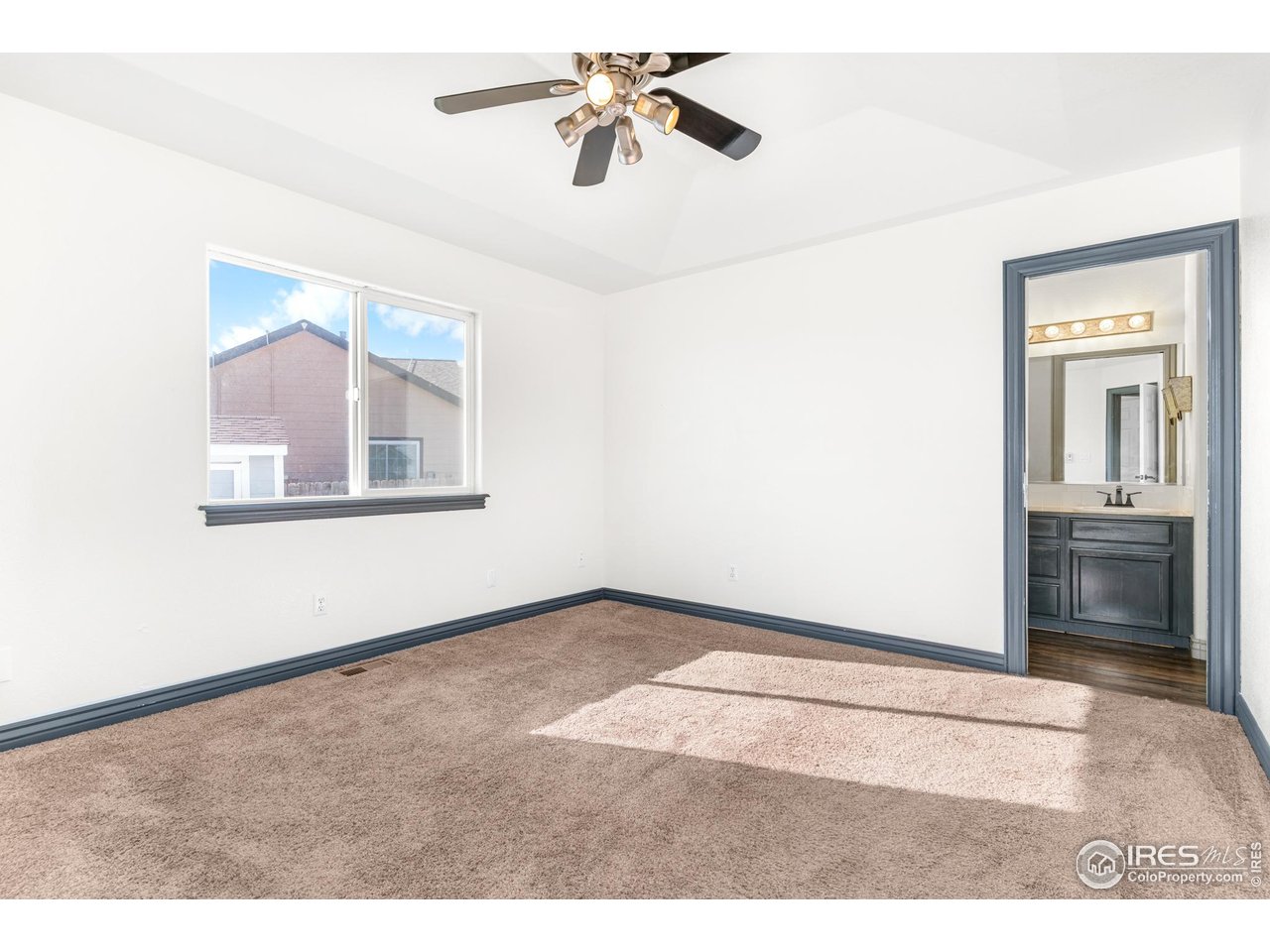 3418 Windmill Court Evans, CO 80620 - Photo 9 of 31 a view of an empty room with a window