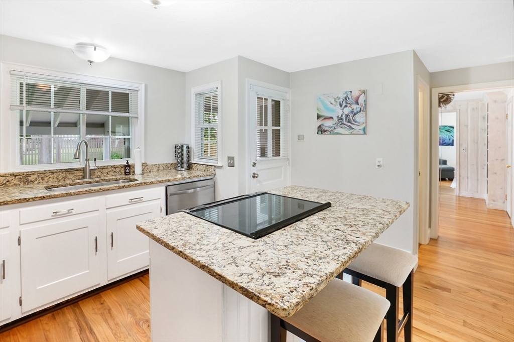 38 Fallston Street Springfield, MA 01119 - Photo 11 of 35 a kitchen with a granite countertop sink and cabinets