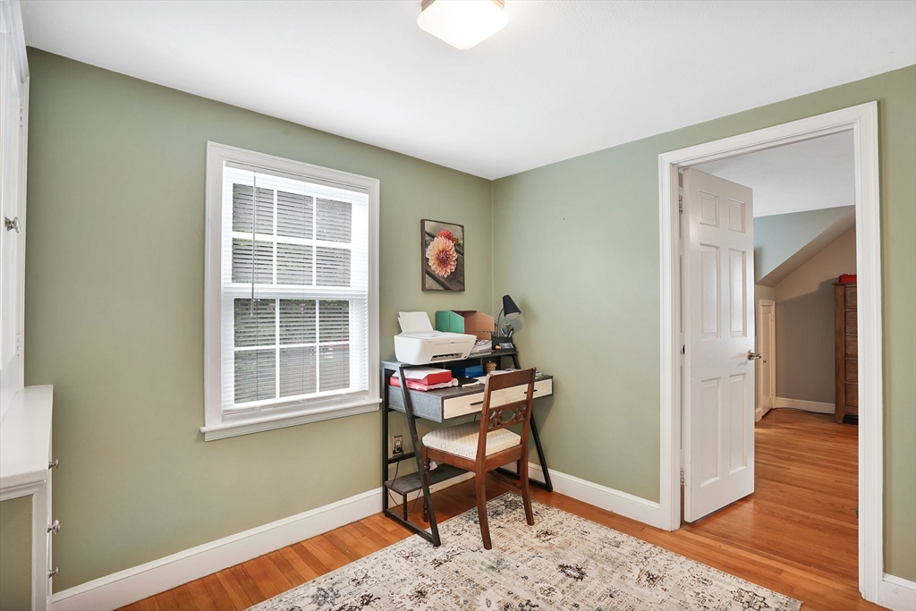 38 Fallston Street Springfield, MA 01119 - Photo 18 of 35 a room that has a dresser and a chair in it