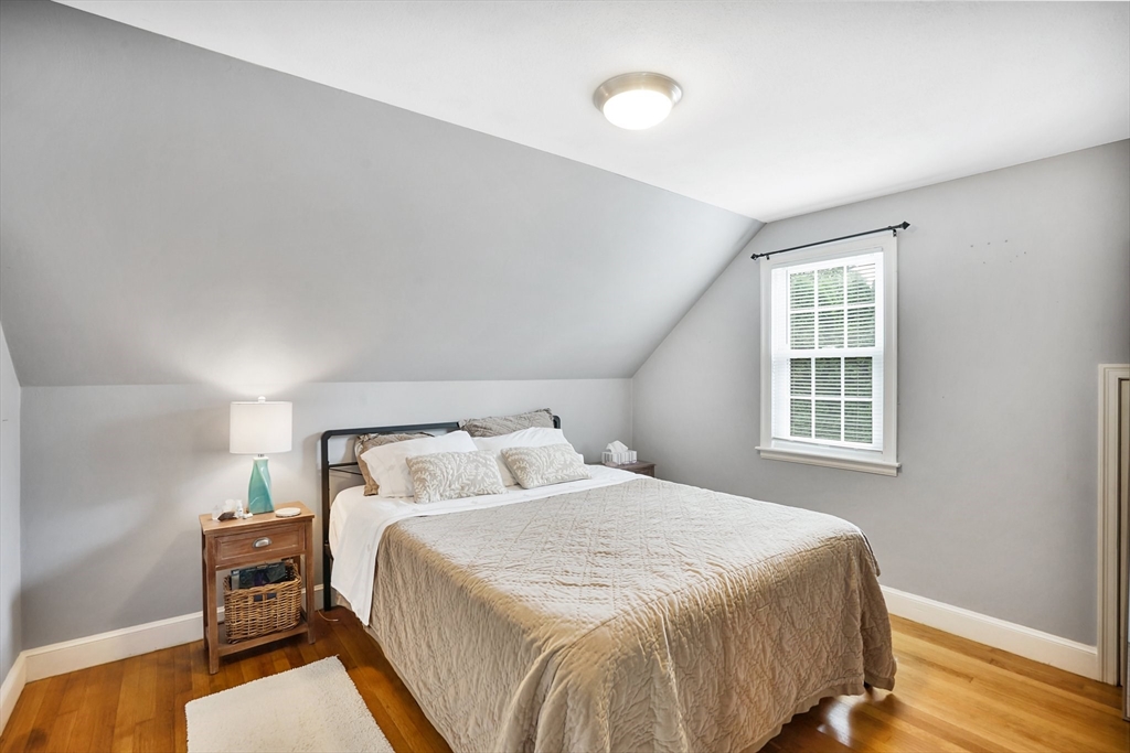 38 Fallston Street Springfield, MA 01119 - Photo 19 of 35 a bedroom with a bed and wooden floor