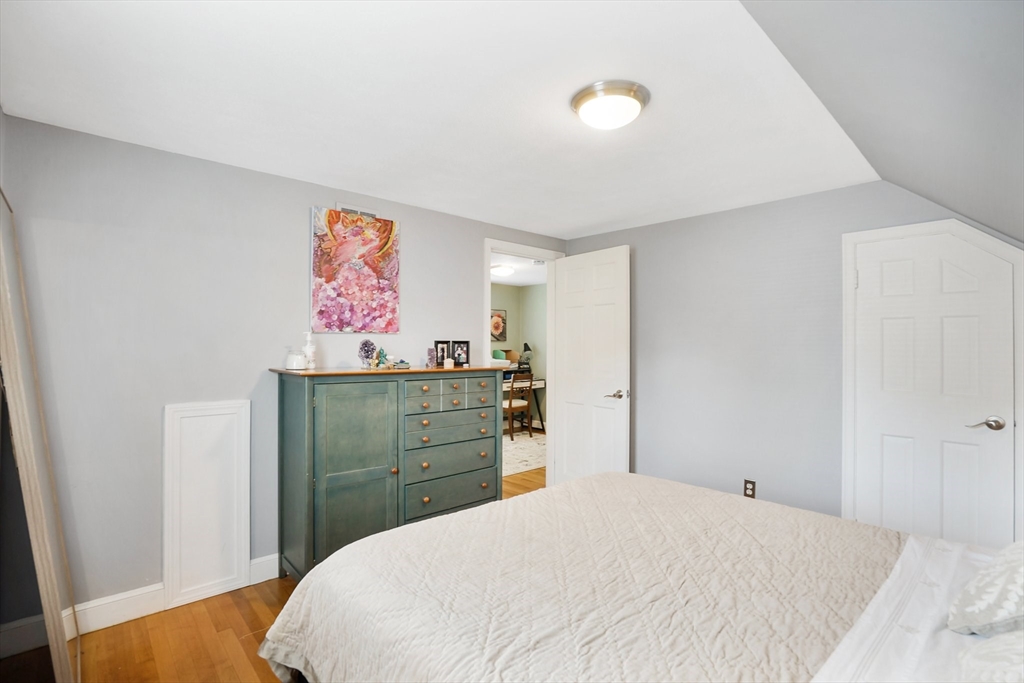 38 Fallston Street Springfield, MA 01119 - Photo 20 of 35 a bedroom with a bed and painting on the wall