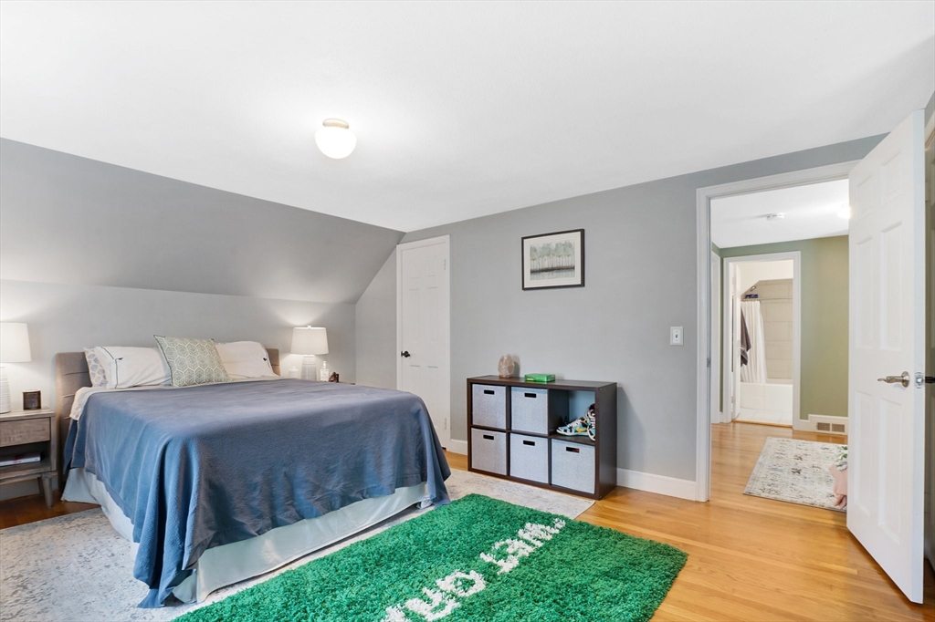 38 Fallston Street Springfield, MA 01119 - Photo 22 of 35 a spacious bedroom with a bed and a view of bathroom