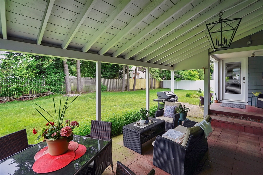 38 Fallston Street Springfield, MA 01119 - Photo 28 of 35 a view of a patio with couches chairs potted plants and a big yard