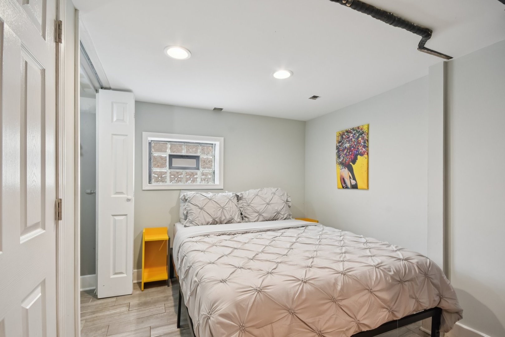 2928 North Rutherford Avenue Chicago, IL 60634 - Photo 17 of 25 a bedroom with a bed and painting on the wall