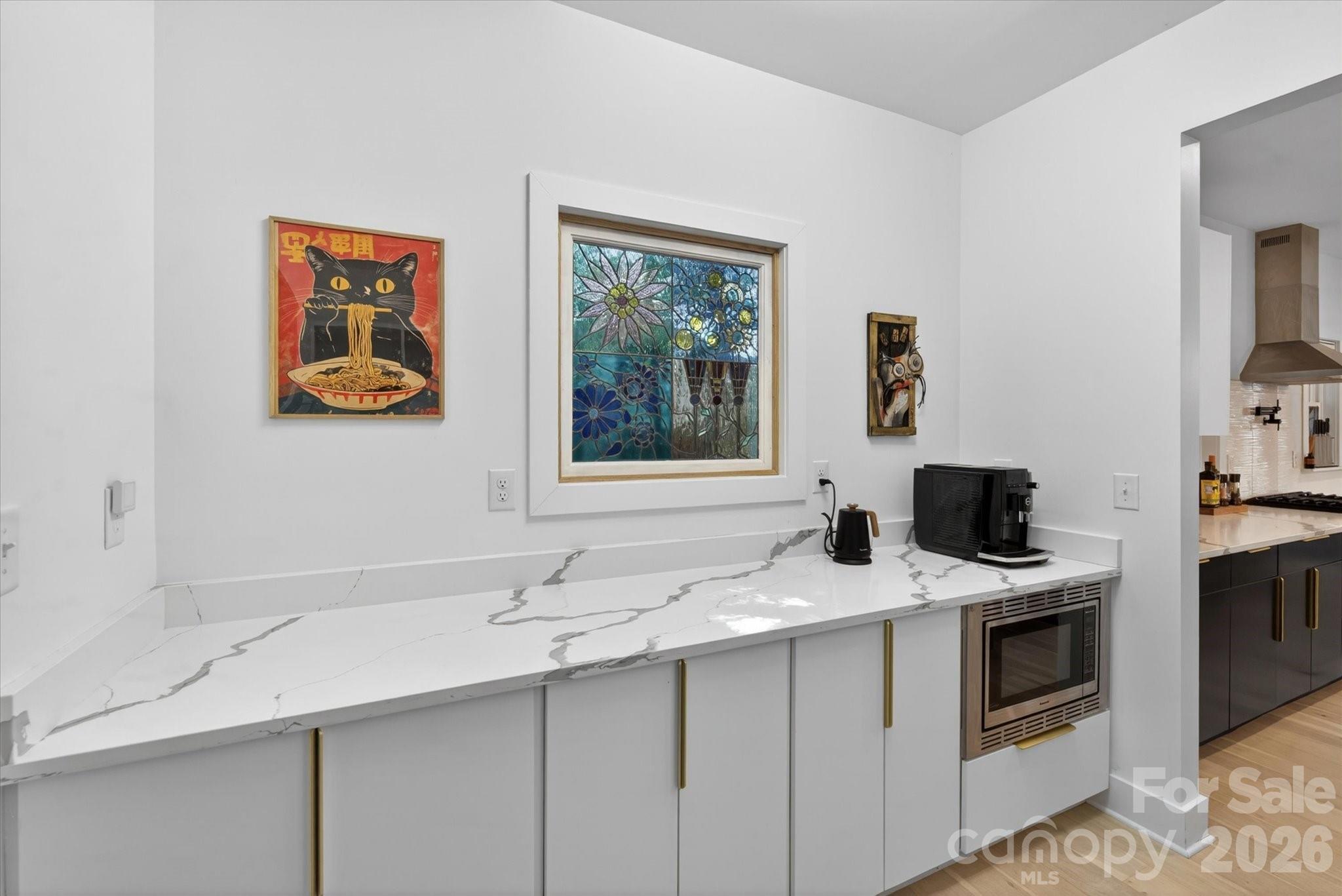 1608 Chippendale Road Charlotte, NC 28205 - Photo 31 of 46 a kitchen with stainless steel appliances granite countertop a sink and a stove with white countertops