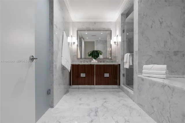 a spacious bathroom with a granite countertop sink and a mirror
