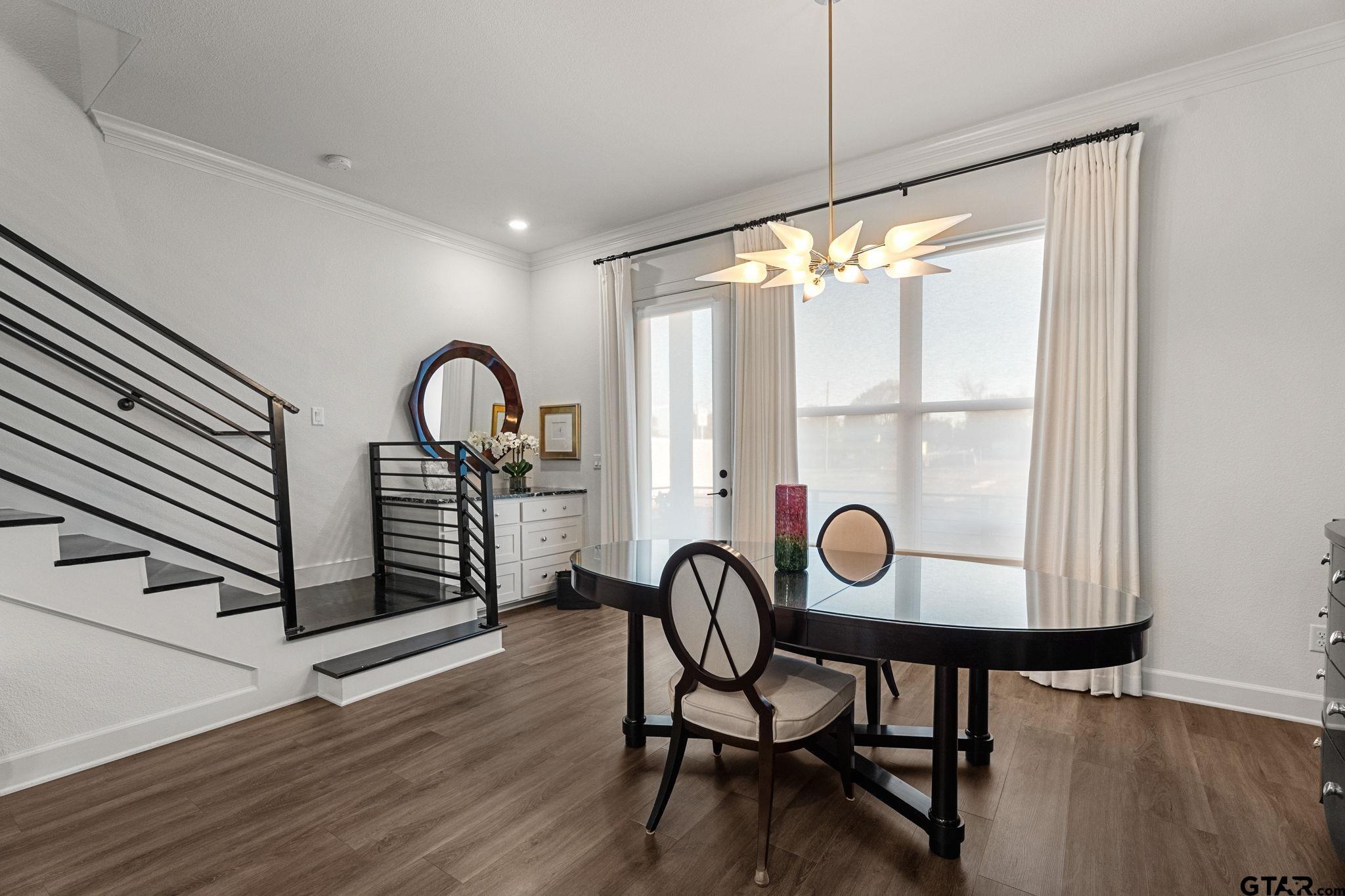 546 West Erwin Street Tyler, TX 75702 - Photo 11 of 31 a view of a room with furniture wooden floor and window