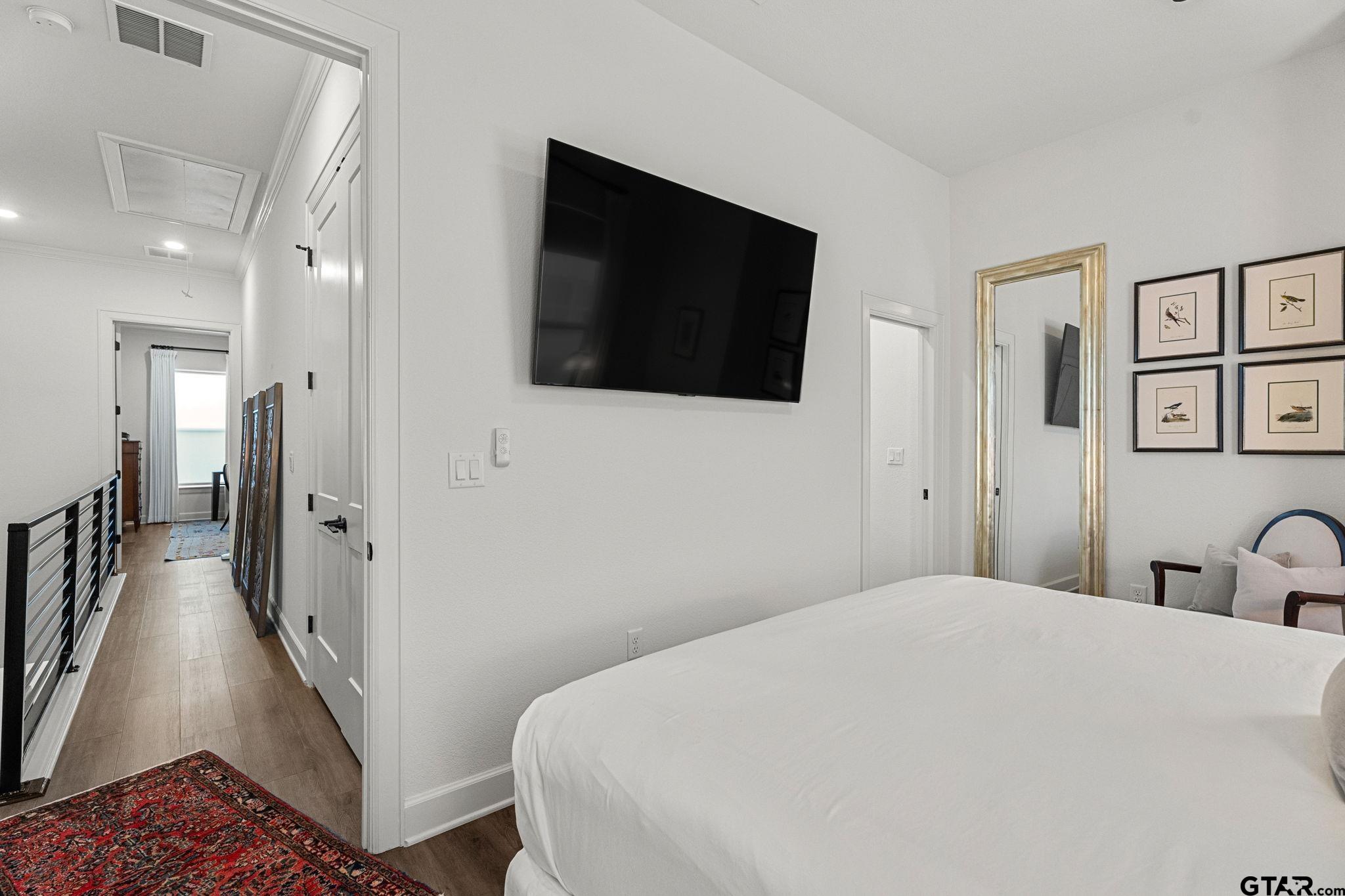 546 West Erwin Street Tyler, TX 75702 - Photo 16 of 31 a large white bed in a white room