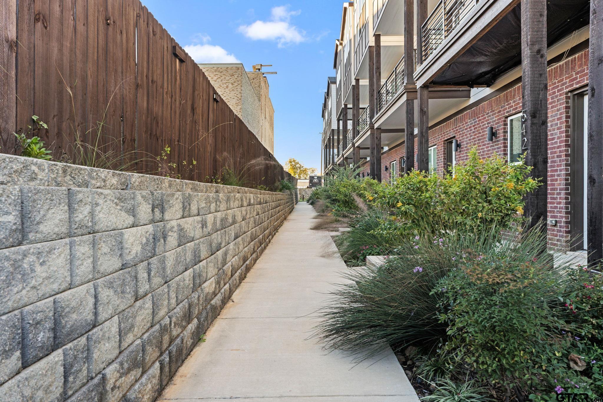 546 West Erwin Street Tyler, TX 75702 - Photo 23 of 31 a view of a pathway with a building in front of it