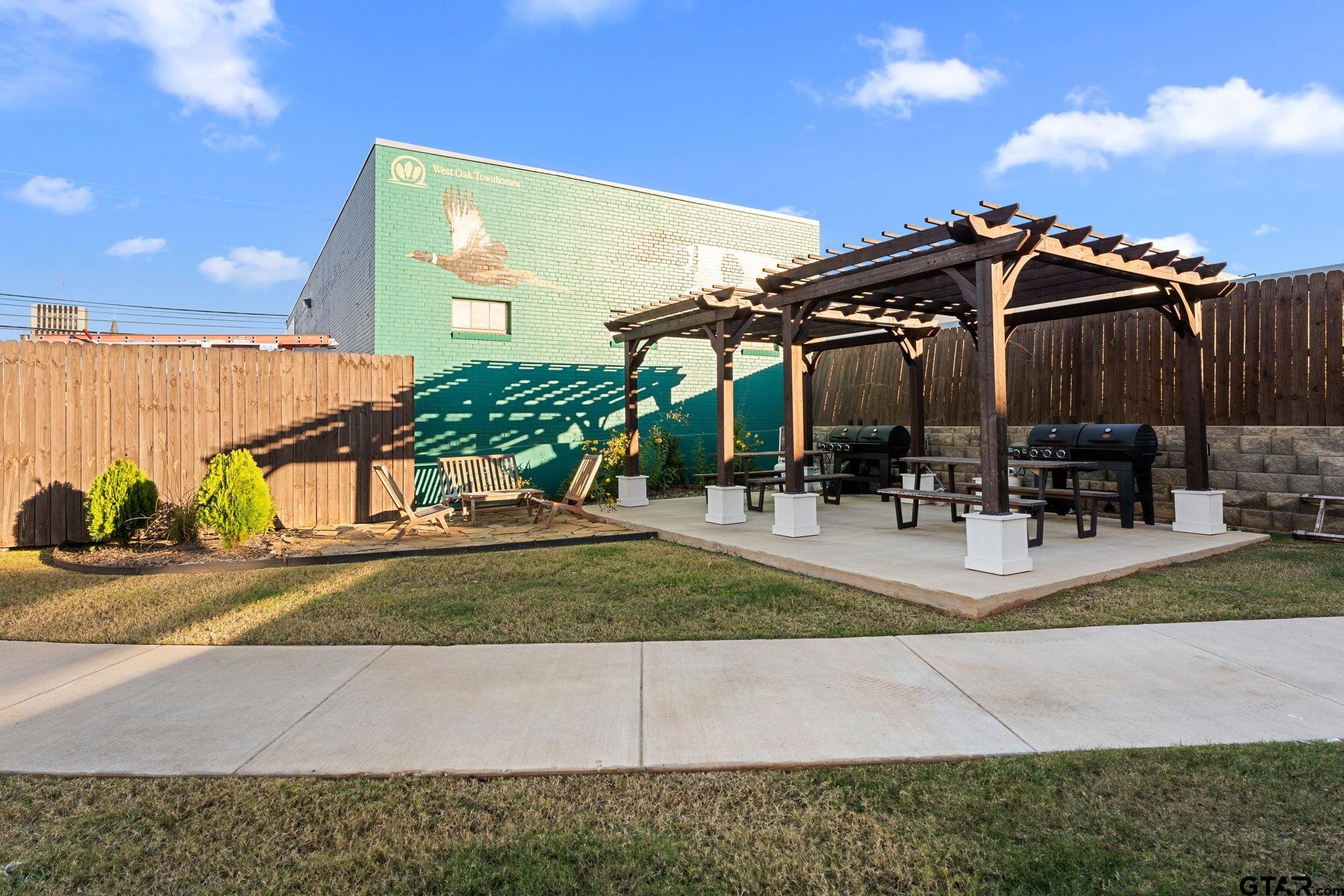 546 West Erwin Street Tyler, TX 75702 - Photo 26 of 31 a view of a yard with table and chairs