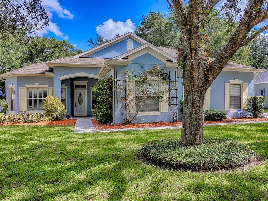 895 Silvertip Road Apopka, FL 32712 - Photo 1 of 1 a front view of a house with a yard and potted plants