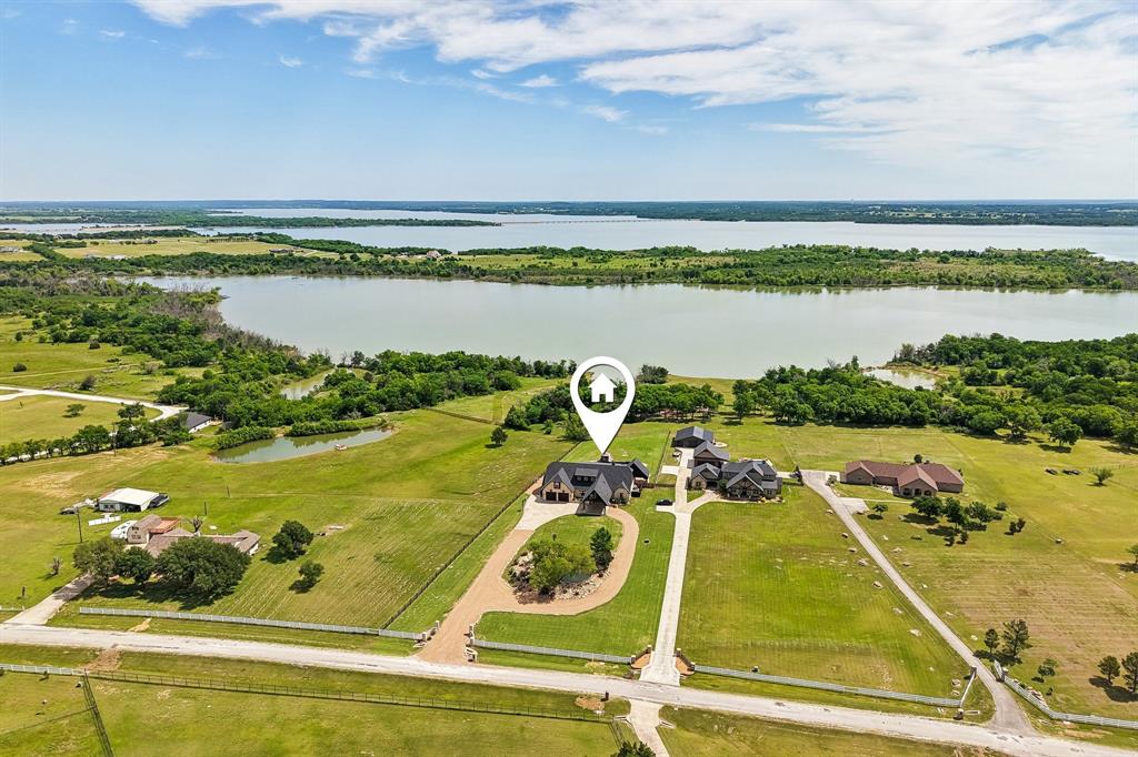 2085 Switzer Road Sanger, TX 76266 - Photo 38 of 39 Expansive property featuring a large body of water, extensive green acreage, perimeter fencing, and established driveways