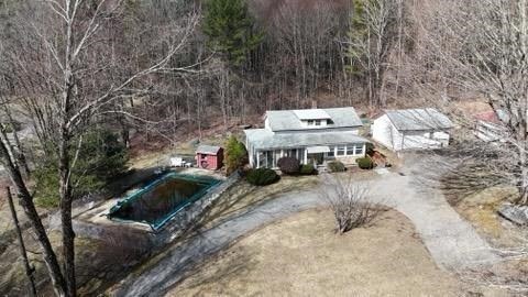 a view of a house with a yard