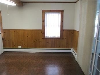 205 Hardwick Road Hardwick, MA 01031 - Photo 13 of 29 an empty room with wooden floor and windows
