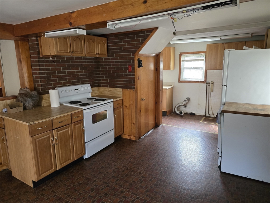205 Hardwick Road Hardwick, MA 01031 - Photo 14 of 29 a kitchen with a stove and wooden floor