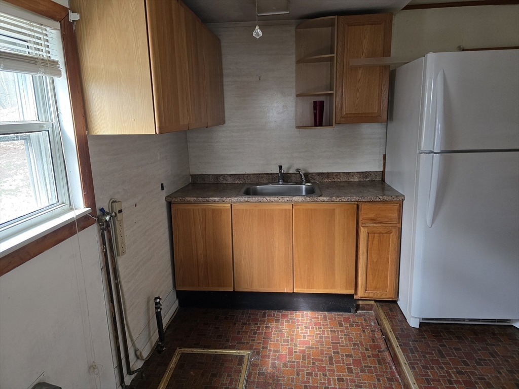 205 Hardwick Road Hardwick, MA 01031 - Photo 15 of 29 a kitchen with stainless steel appliances granite countertop a refrigerator and a stove
