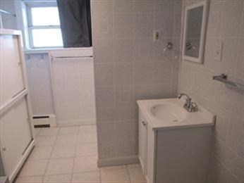 205 Hardwick Road Hardwick, MA 01031 - Photo 21 of 29 a bathroom with a sink a toilet and a window