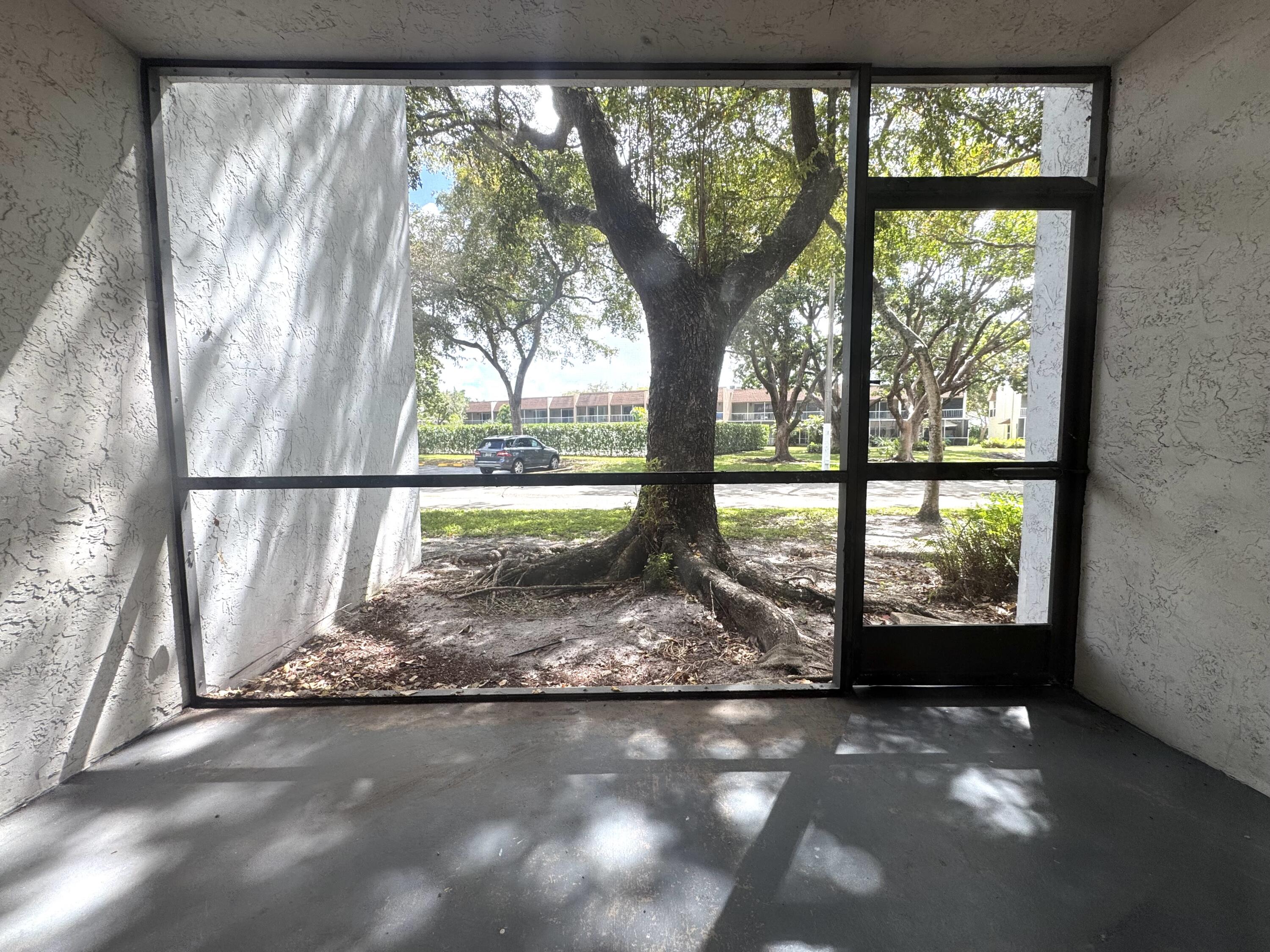 701 North Pine Island Road, Unit 105 Plantation, FL 33324 - Photo 13 of 23 a view of empty room with large windows