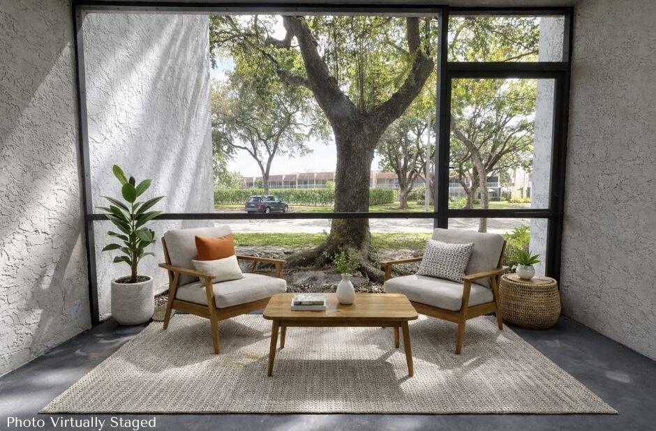 701 North Pine Island Road, Unit 105 Plantation, FL 33324 - Photo 20 of 23 a outdoor living space with furniture and a potted plant