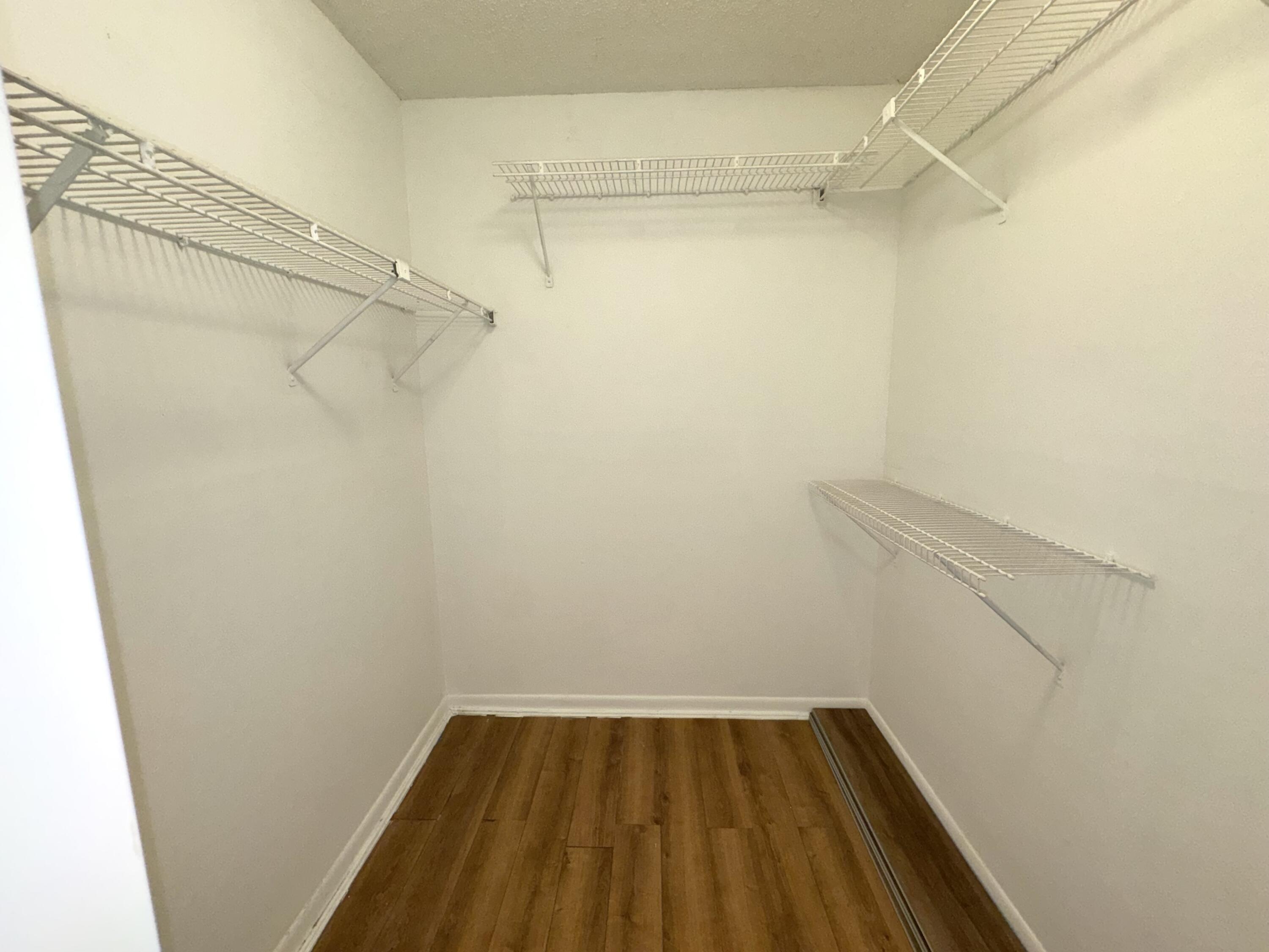 701 North Pine Island Road, Unit 105 Plantation, FL 33324 - Photo 8 of 23 a view of a room with racks on the wall