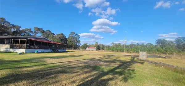 a view of a house with a big yard