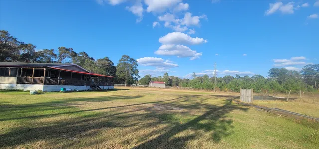 a view of a house with a big yard