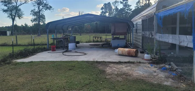 a view of a backyard with furniture