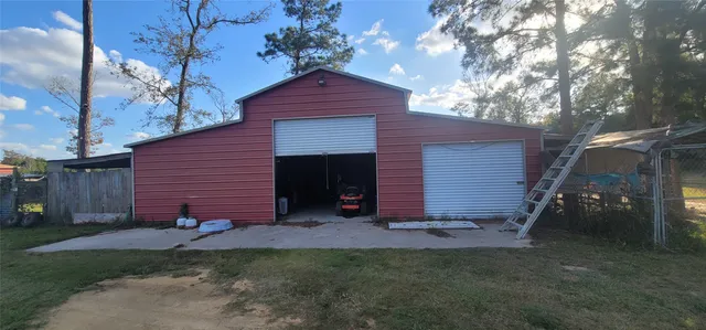 a view of a backyard with table and chairs and potted plants