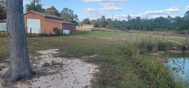 a view of lake with green space