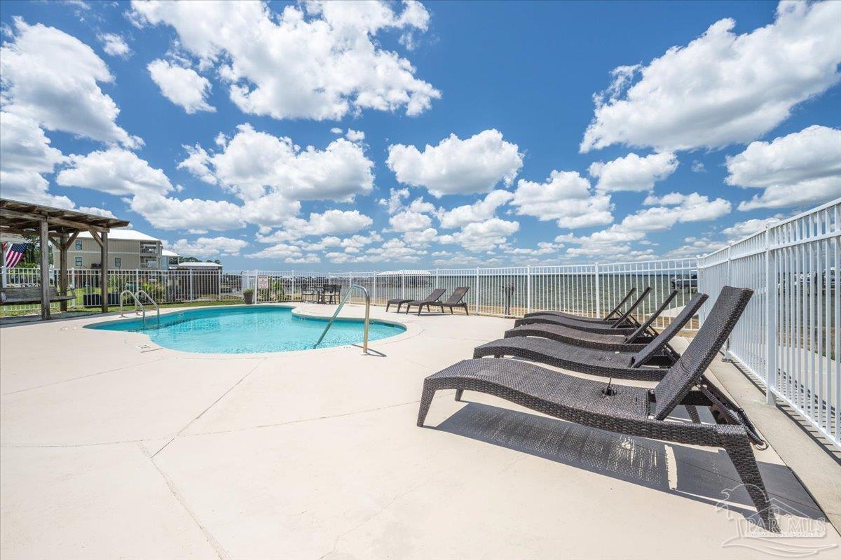 26063 Canal Road, Unit 3F Orange Beach, AL 36561 - Photo 7 of 72 a view of a patio with a yard