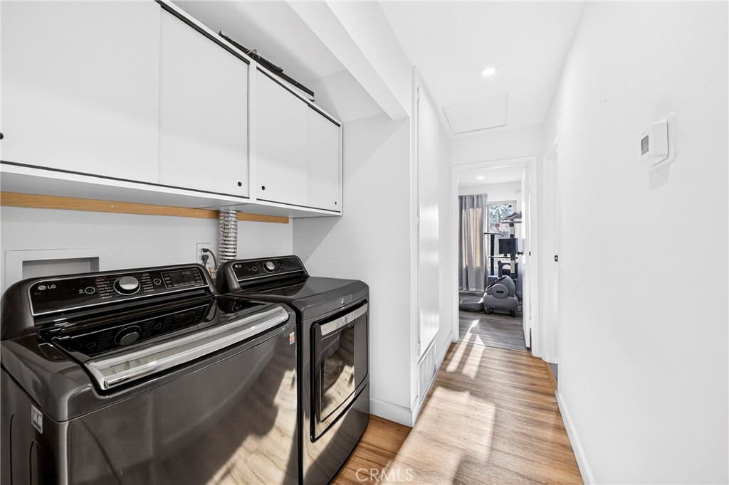5050 Brooklawn Place Riverside, CA 92504 - Photo 25 of 44 a hallway with a stove top oven a refrigerator and a window