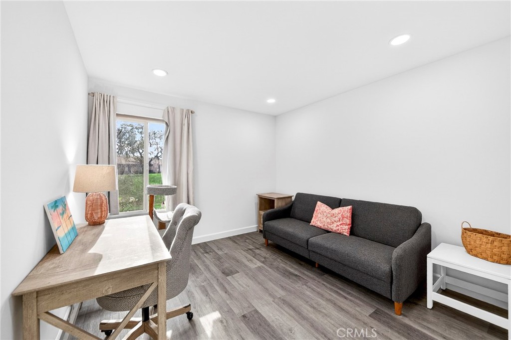 5050 Brooklawn Place Riverside, CA 92504 - Photo 26 of 44 a living room with furniture and a wooden floor