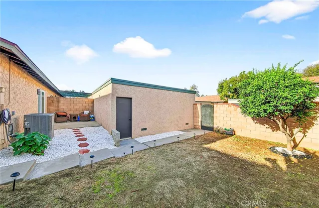 a house view with a backyard space