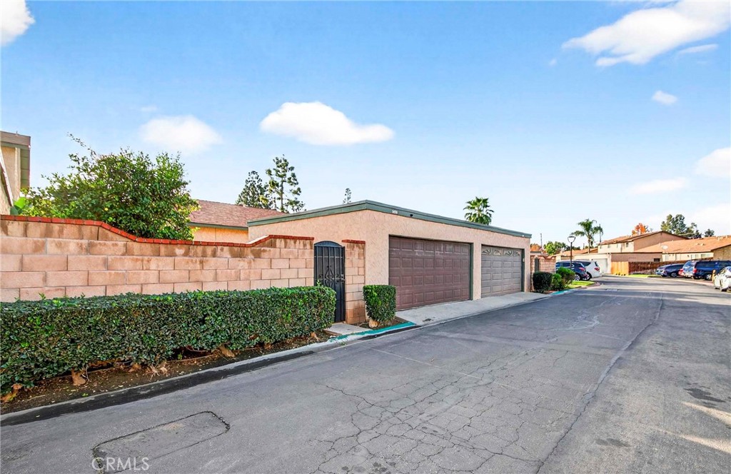 5050 Brooklawn Place Riverside, CA 92504 - Photo 37 of 44 a view of a house with a yard and potted plants