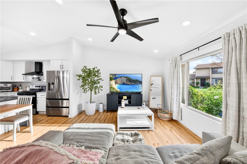 5050 Brooklawn Place Riverside, CA 92504 - Photo 4 of 44 a living room with furniture and a large window