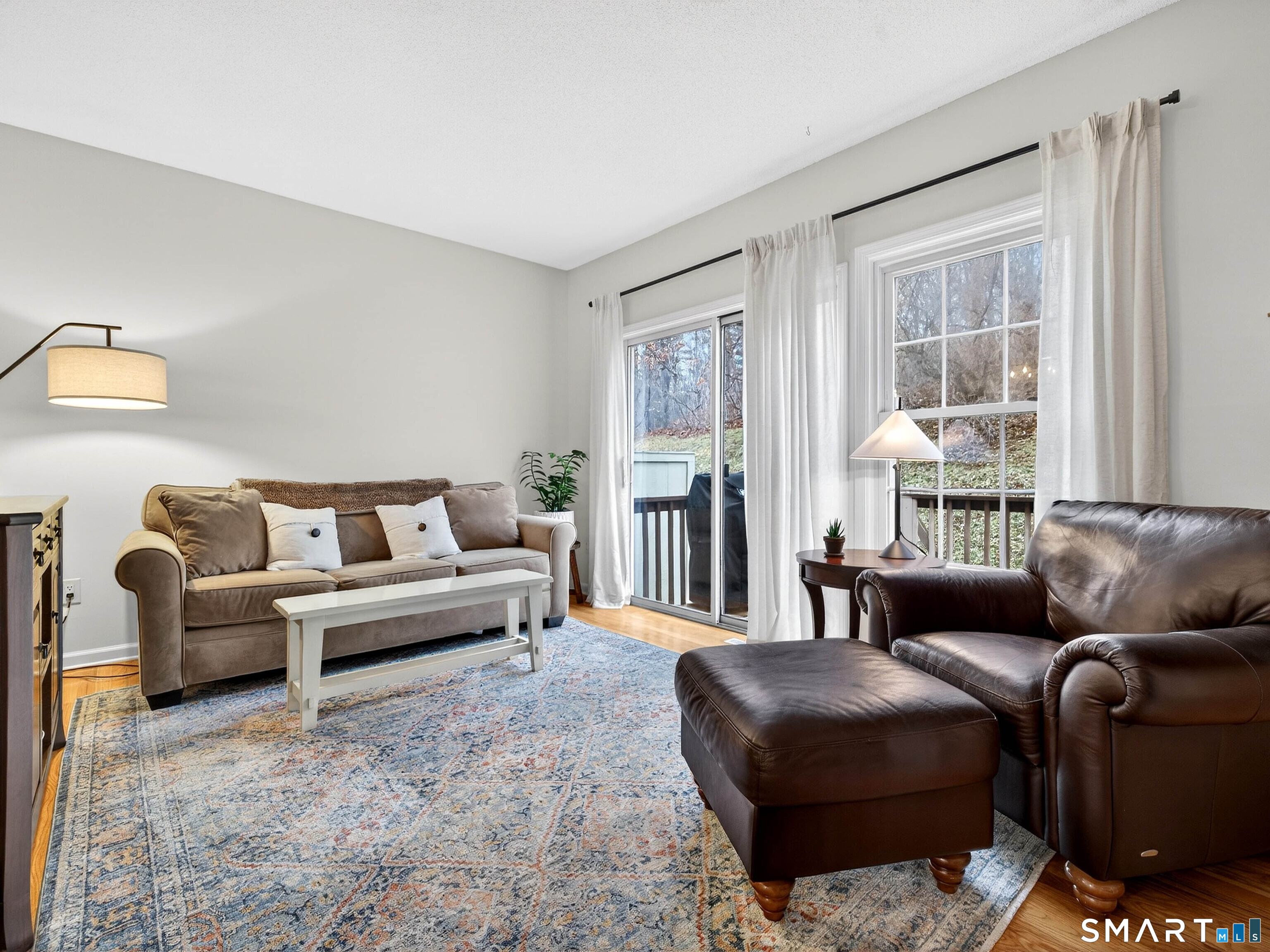 102 Foxbridge Village Road, Unit 102 Branford, CT 06405 - Photo 13 of 38 Living room w/slider to deck