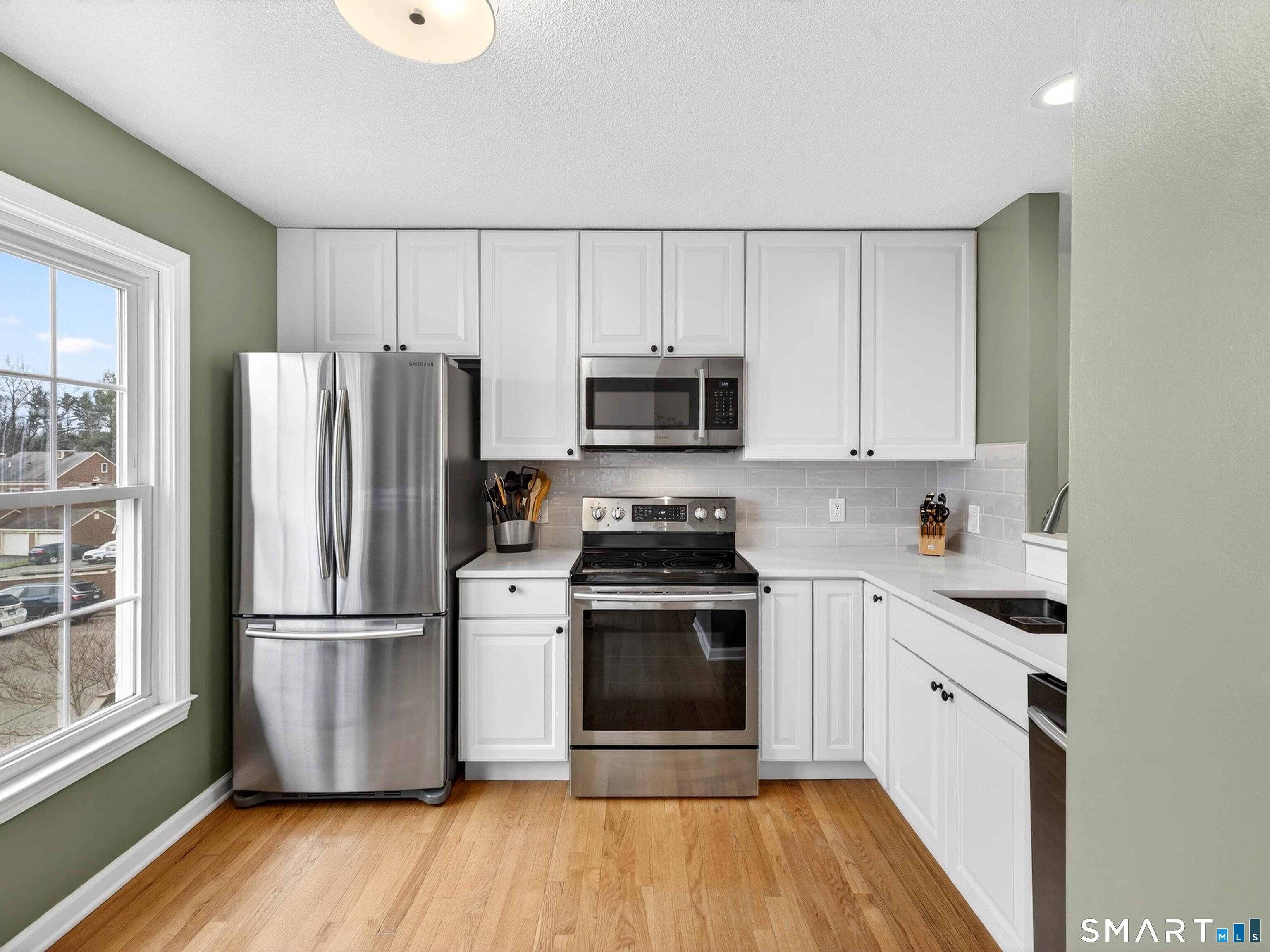 102 Foxbridge Village Road, Unit 102 Branford, CT 06405 - Photo 6 of 38 Kitchen with quartz counters & stainless appliances