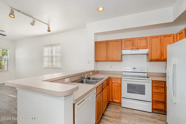 a kitchen that has a sink and a stove