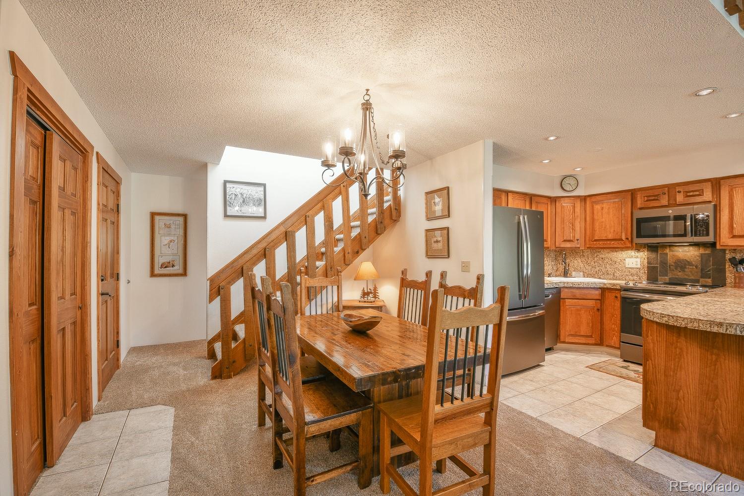 400 4 O Clock Road, Unit E Breckenridge, CO 80424 - Photo 12 of 34 a dining room with furniture and entryway