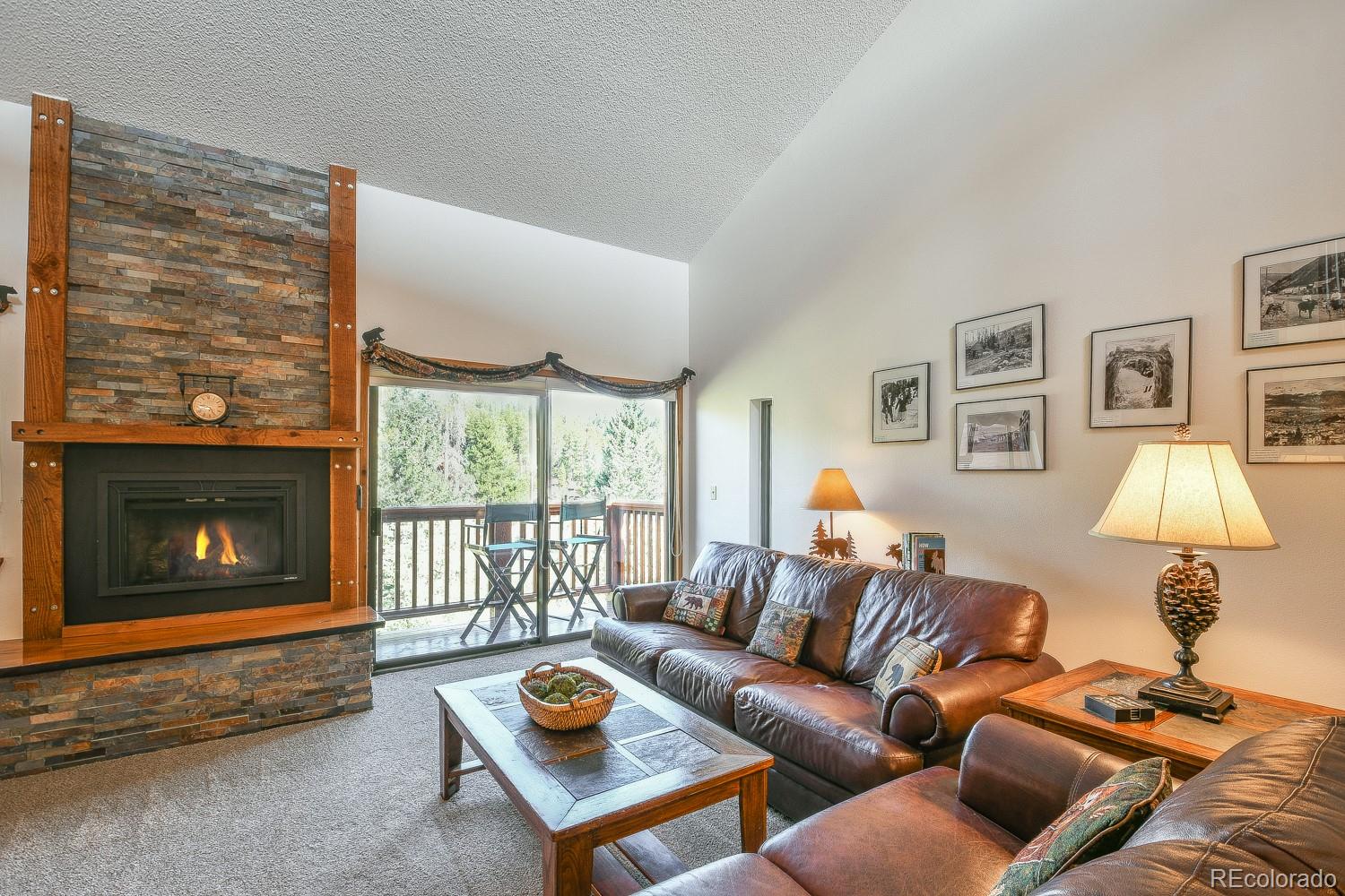 400 4 O Clock Road, Unit E Breckenridge, CO 80424 - Photo 14 of 34 a living room with furniture and a fireplace