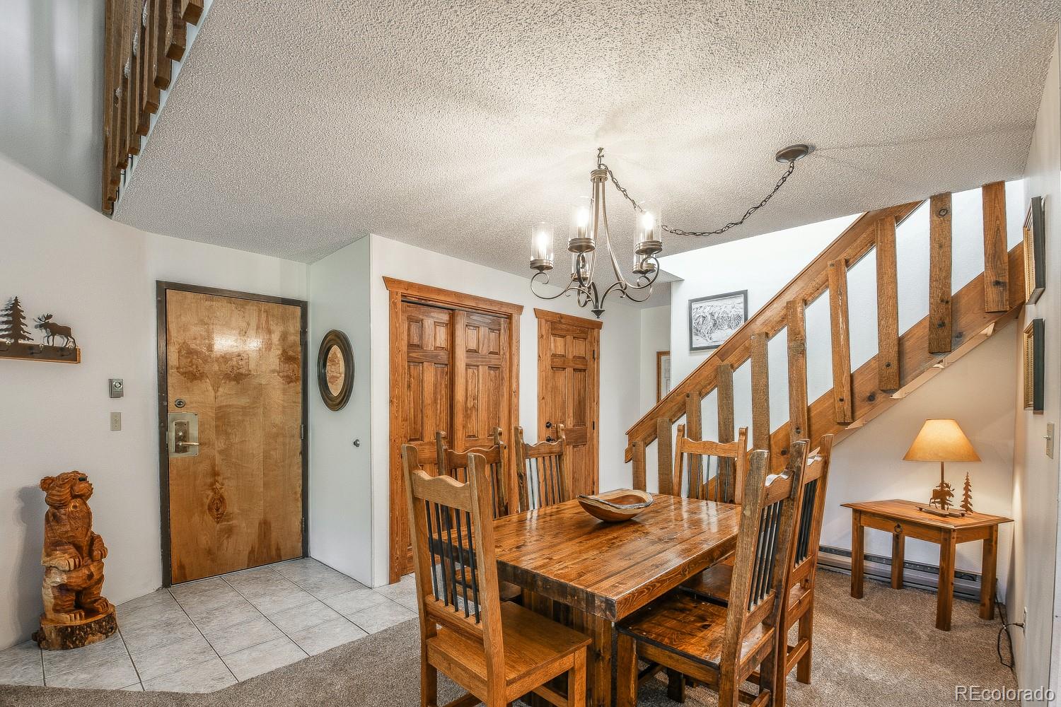 400 4 O Clock Road, Unit E Breckenridge, CO 80424 - Photo 17 of 34 a view of entryway dining room and hall with wooden floor