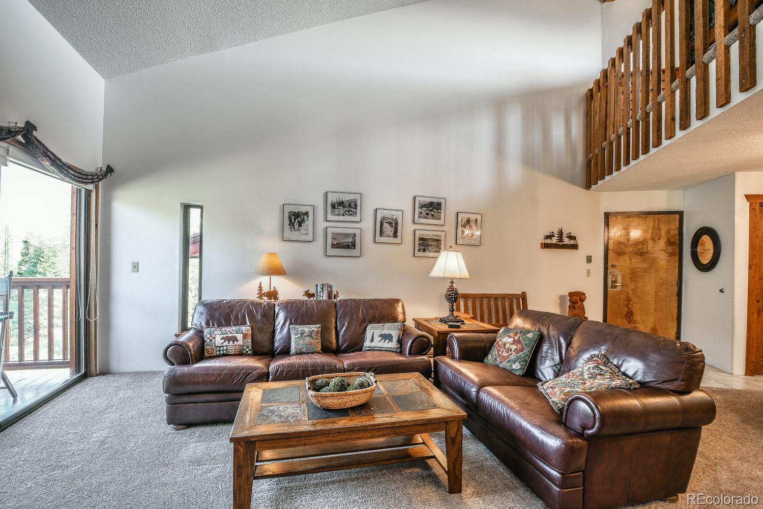400 4 O Clock Road, Unit E Breckenridge, CO 80424 - Photo 2 of 34 a living room with furniture and a couch
