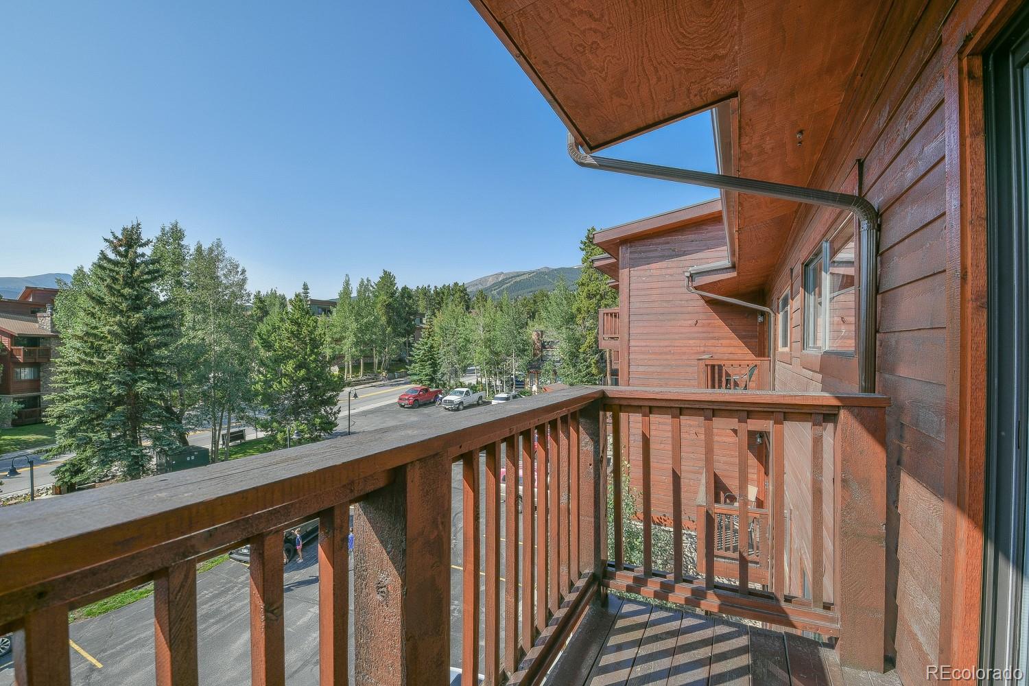 400 4 O Clock Road, Unit E Breckenridge, CO 80424 - Photo 26 of 34 a view of a balcony with wooden fence and floor