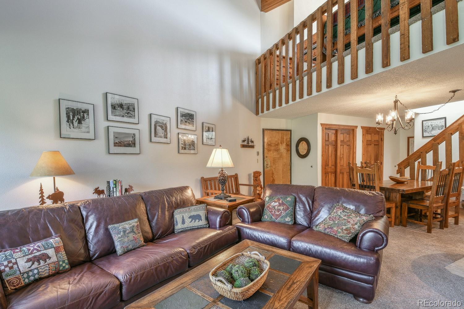 400 4 O Clock Road, Unit E Breckenridge, CO 80424 - Photo 5 of 34 a living room with furniture a lamp and a rug