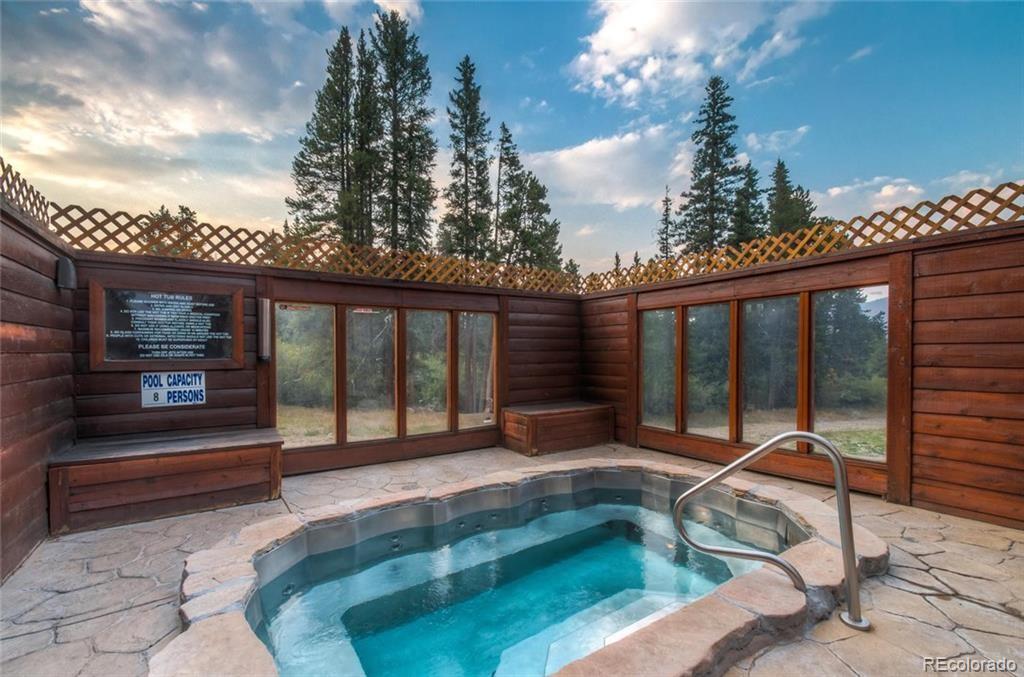 400 4 O Clock Road, Unit E Breckenridge, CO 80424 - Photo 10 of 34 a swimming pool with outdoor seating yard and barbeque oven